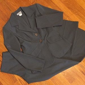 Women’s pin striped suit.